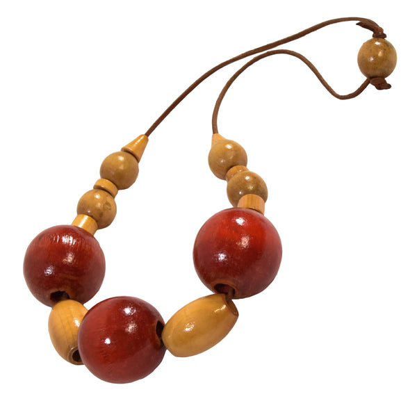 VINTAGE necklace from 1980 with large wooden beads and leather cord. Red and yellow colors.