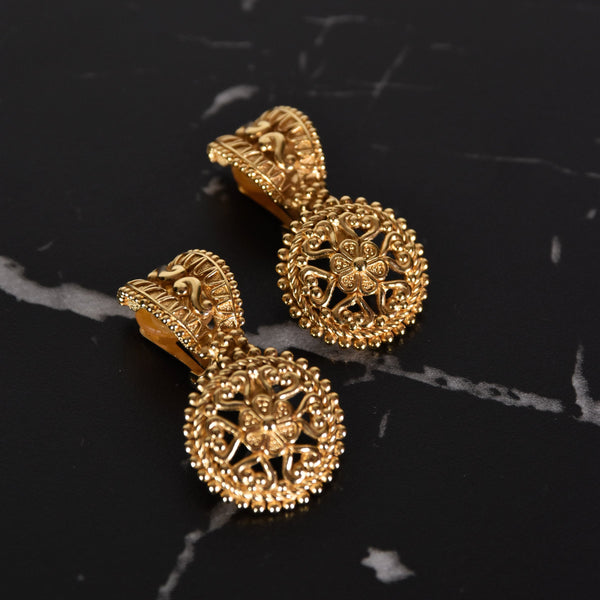 CHRISTIAN DIOR clip-on earrings, gold ovoid and circular design dangle earrings adorned with floral & heart motifs.